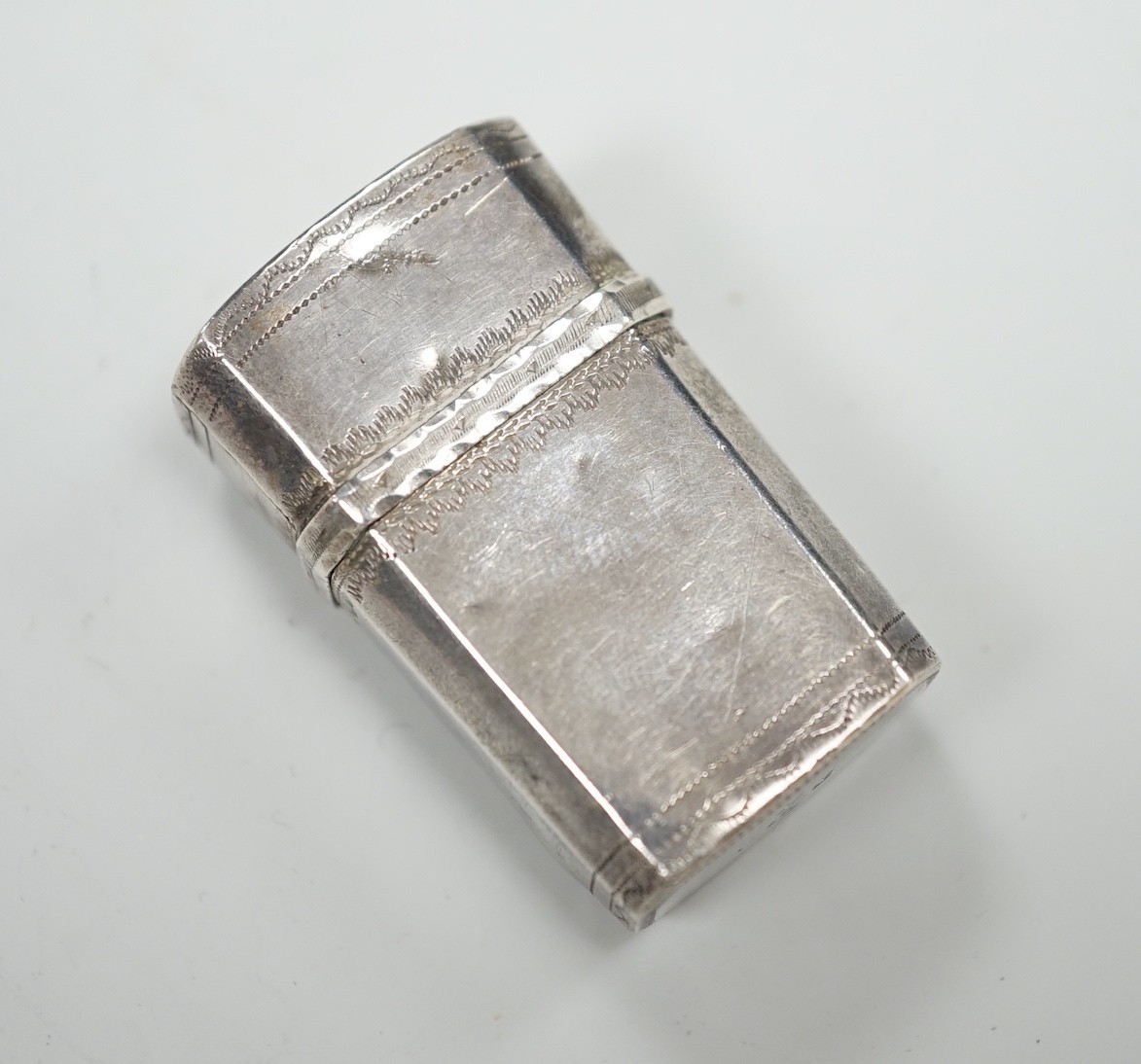A George IV engraved silver fleam case?, by Thomas Wilmore?, Birmingham, 1822, 36mm.